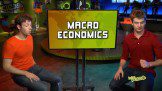 two boys sitting near a Macro Economics screen