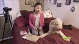 Girl on bed with her pet dog