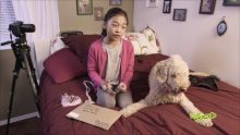 Girl on bed with her pet dog