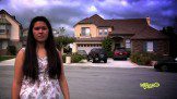 a young lady and a house in the background