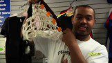 A man showing a white basketball net