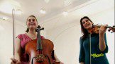 Two sister holding guiter