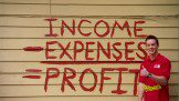 Man pointing at Income Expense Profit