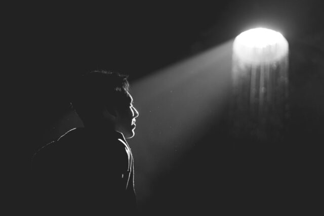 Man looking at light shine