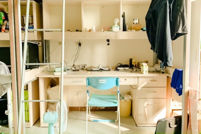 A dirty room of a person with a stair