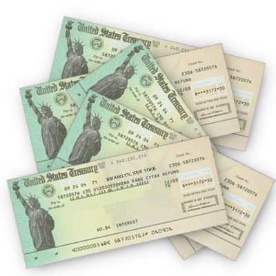 A stack of united states checks with the statue of liberty.