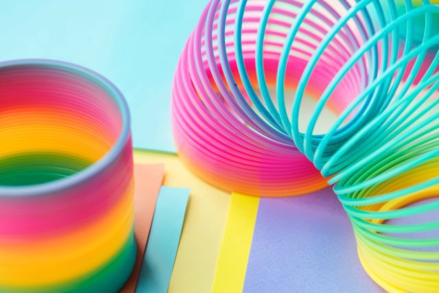 Colorful slinkys on a colorful background.